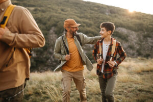 Father and son having fun on hiking tour