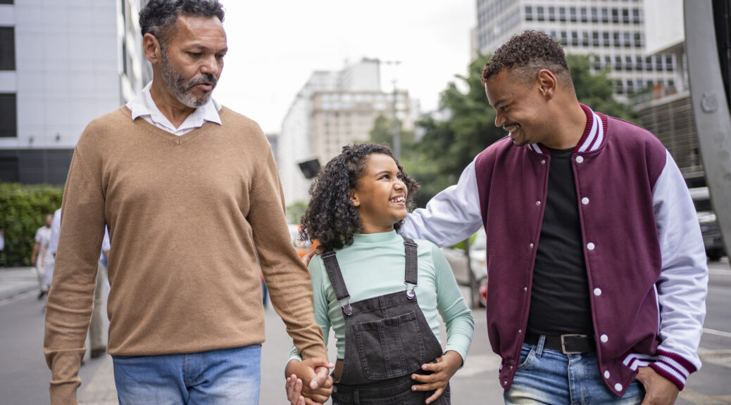 couple with adopted girl at Paulista Avenue in Sao Paulo , Brazil